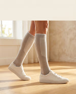 Woman wearing Seidenmaier graduated compression socks, grey